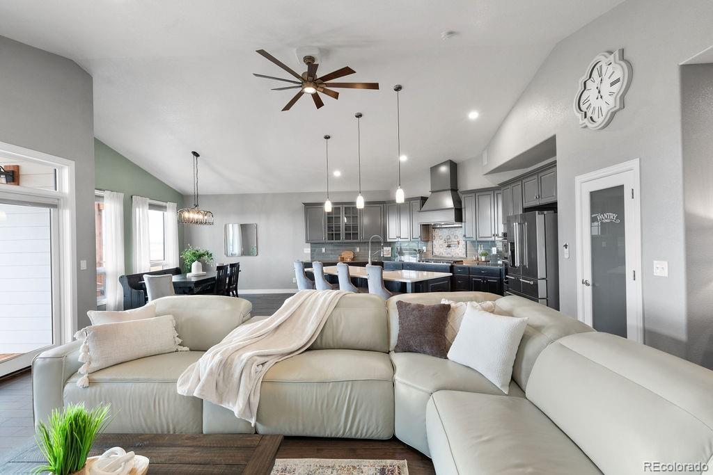 3050 Native Court Wellington, CO 80549 - Photo 21 of 50 a living room with furniture and a large window