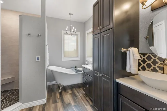 a bathroom with a sink toilet and shower
