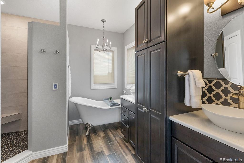 3050 Native Court Wellington, CO 80549 - Photo 25 of 50 a bathroom with a sink toilet and shower