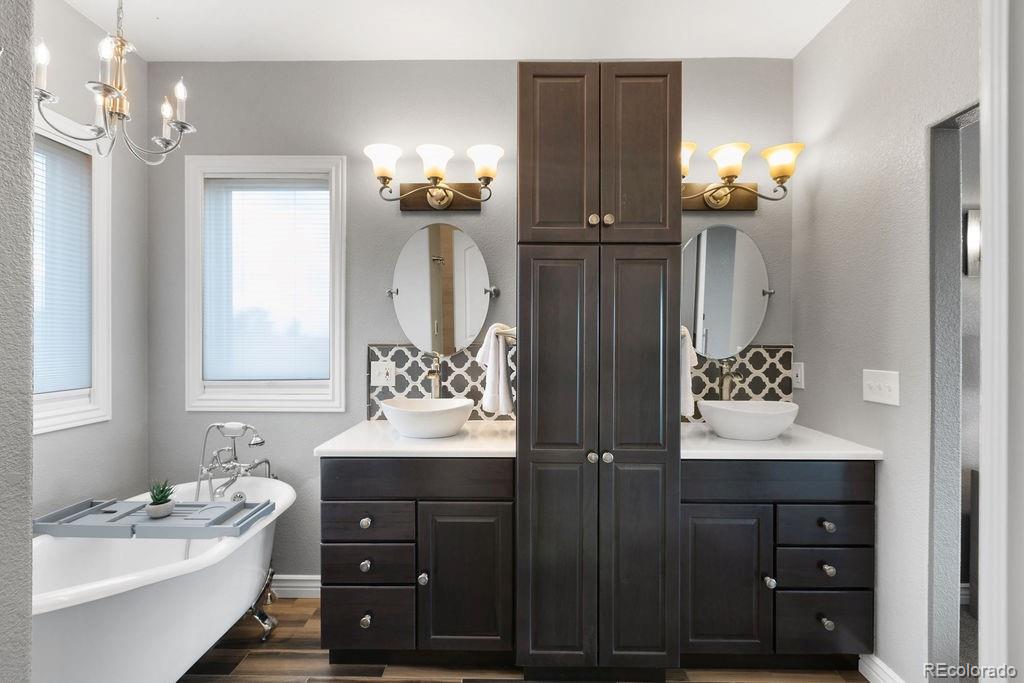 3050 Native Court Wellington, CO 80549 - Photo 27 of 50 a bathroom with a sink vanity and a mirror