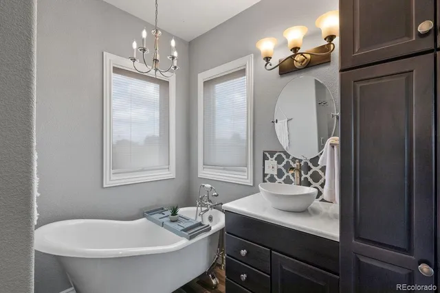 a bathroom with a sink double vanity and a mirror