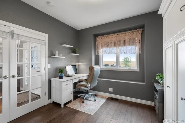 a workspace with furniture and a window