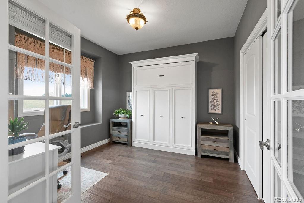 3050 Native Court Wellington, CO 80549 - Photo 33 of 50 a view of workspace with wooden floor and windows