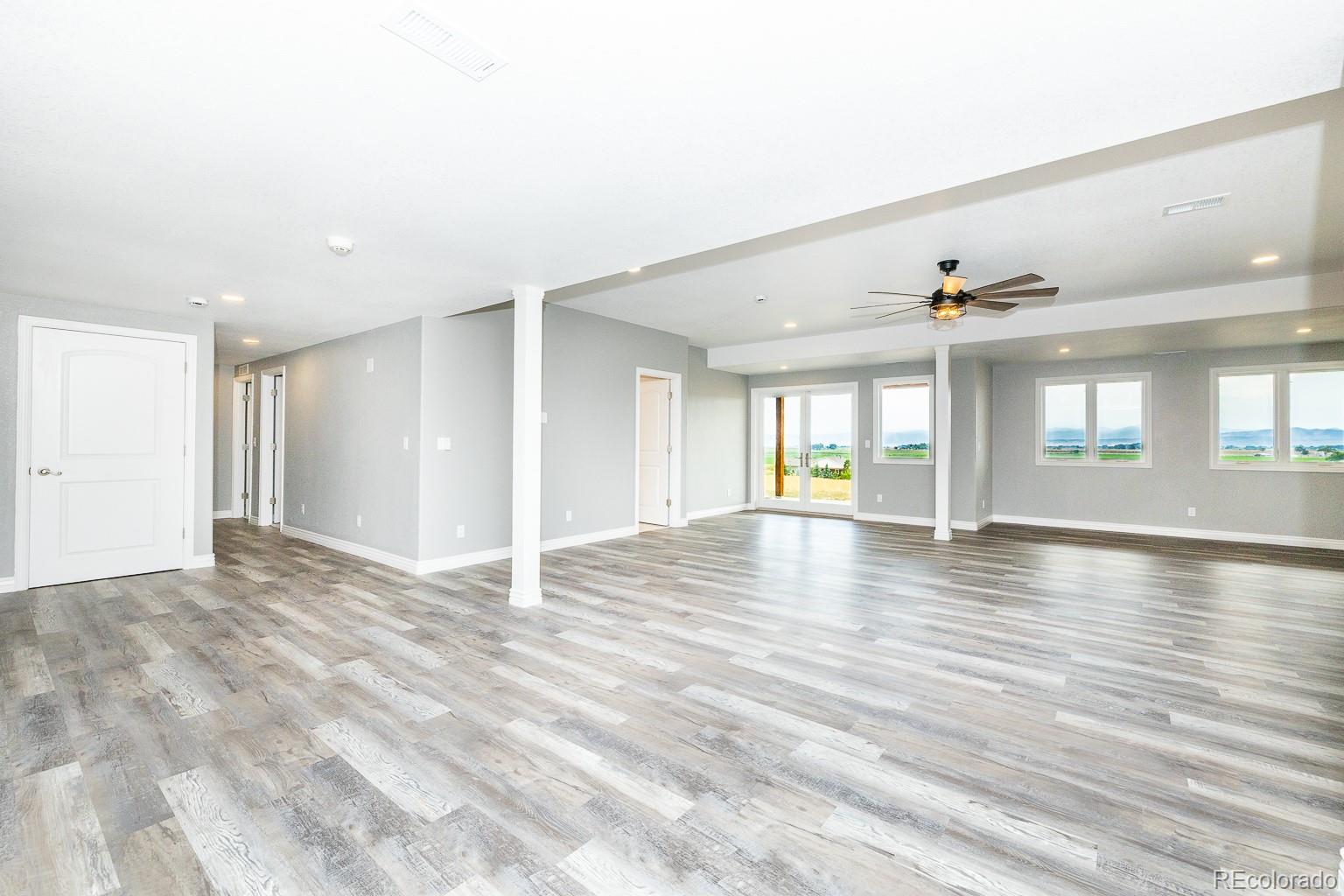 3050 Native Court Wellington, CO 80549 - Photo 35 of 50 a view of an empty room with window and wooden floor