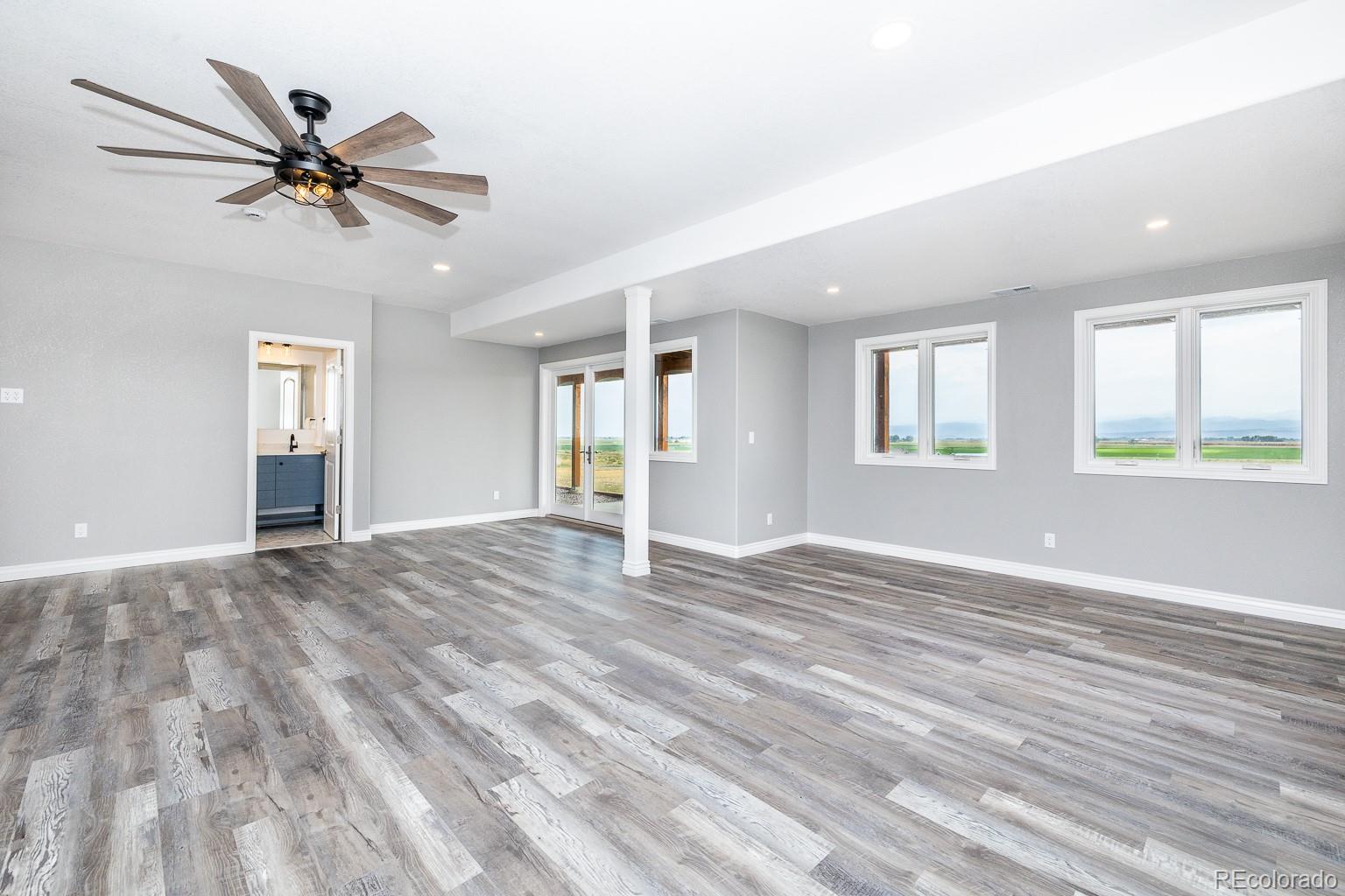 3050 Native Court Wellington, CO 80549 - Photo 36 of 50 a view of an empty room with window and wooden floor