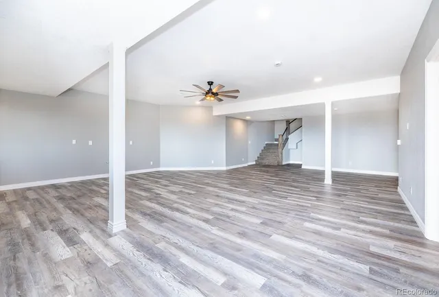 a view of a room with wooden floor