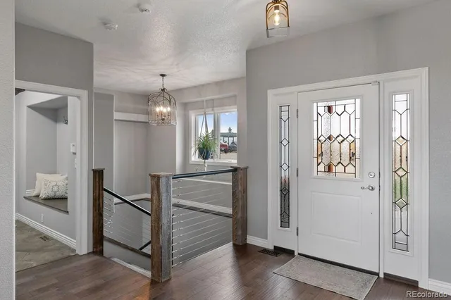 a view of a hallway view with wooden floor and staircase