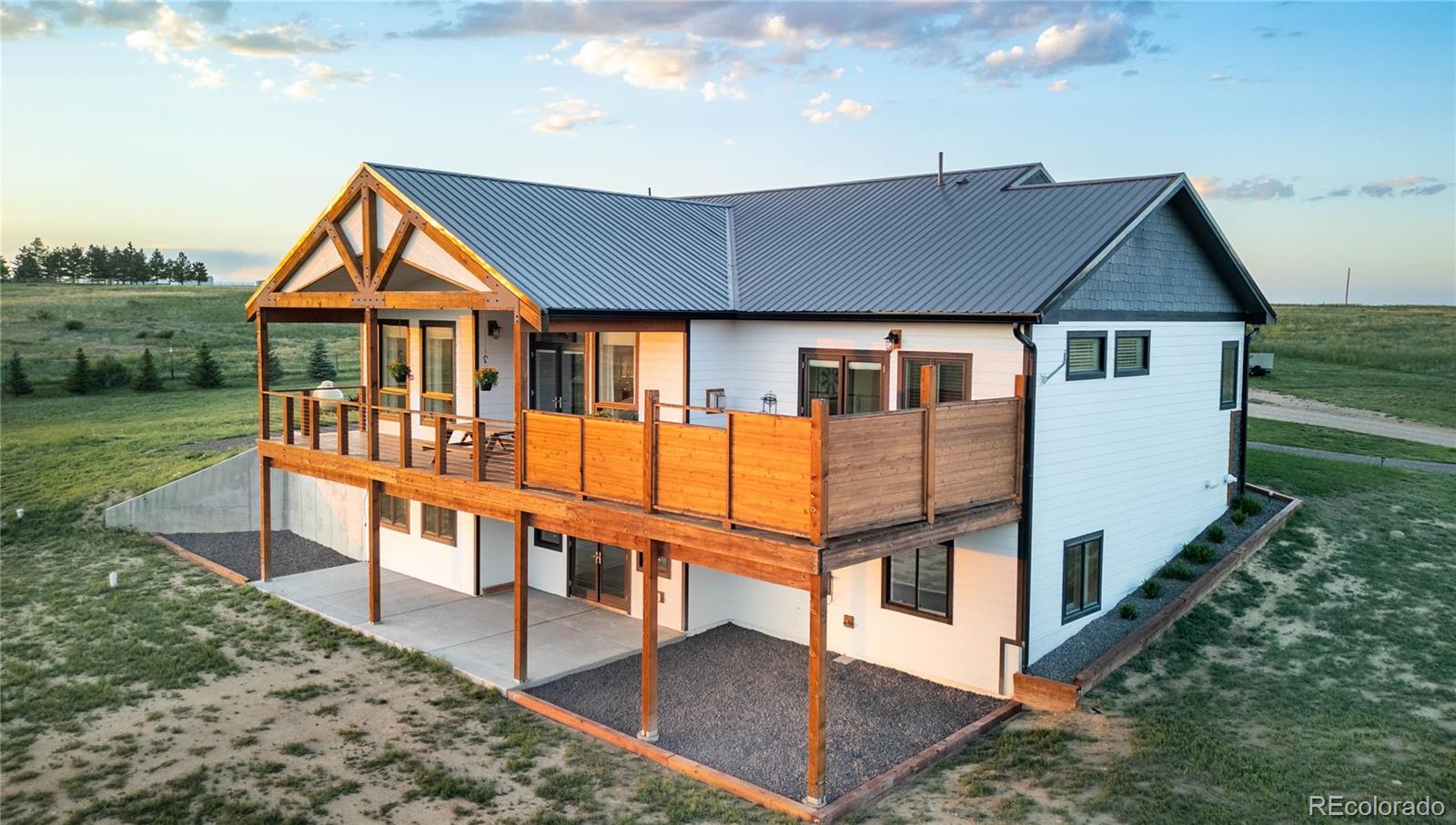 3050 Native Court Wellington, CO 80549 - Photo 42 of 50 a view of house with a yard and balcony