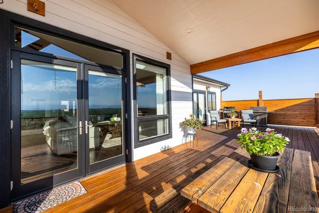 a lobby with furniture and floor to ceiling window
