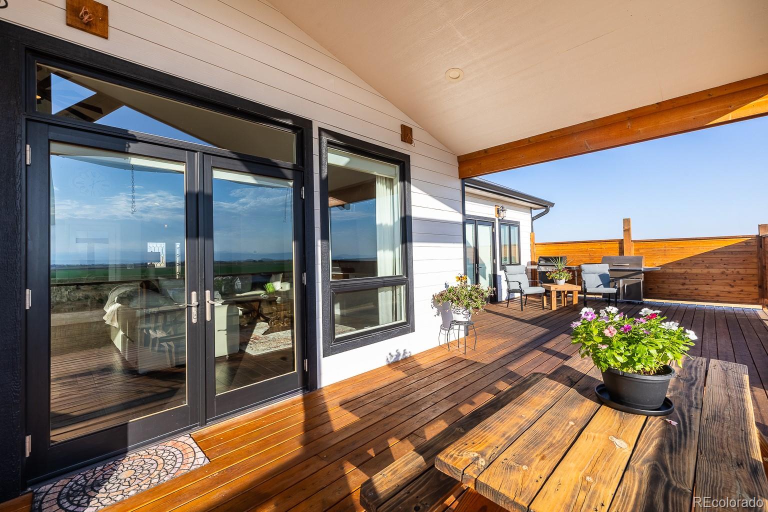 3050 Native Court Wellington, CO 80549 - Photo 44 of 50 a lobby with furniture and floor to ceiling window
