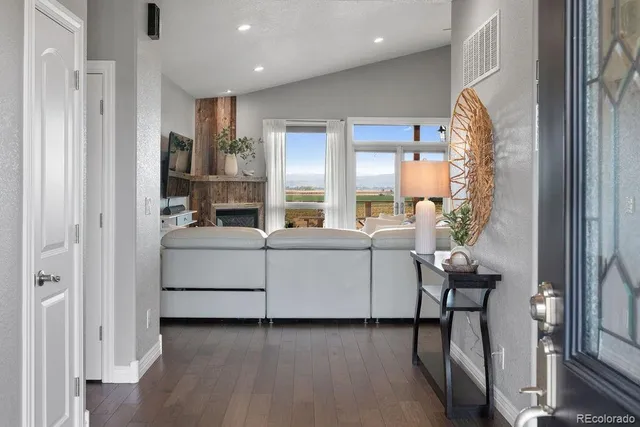 a view of living room with furniture and a window