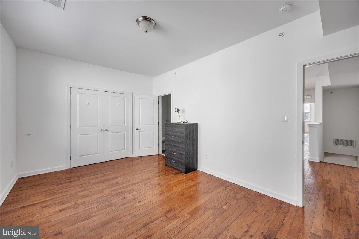1322 North 15th Street, Unit B Philadelphia, PA 19121 - Photo 20 of 24 a view of empty room with wooden floor