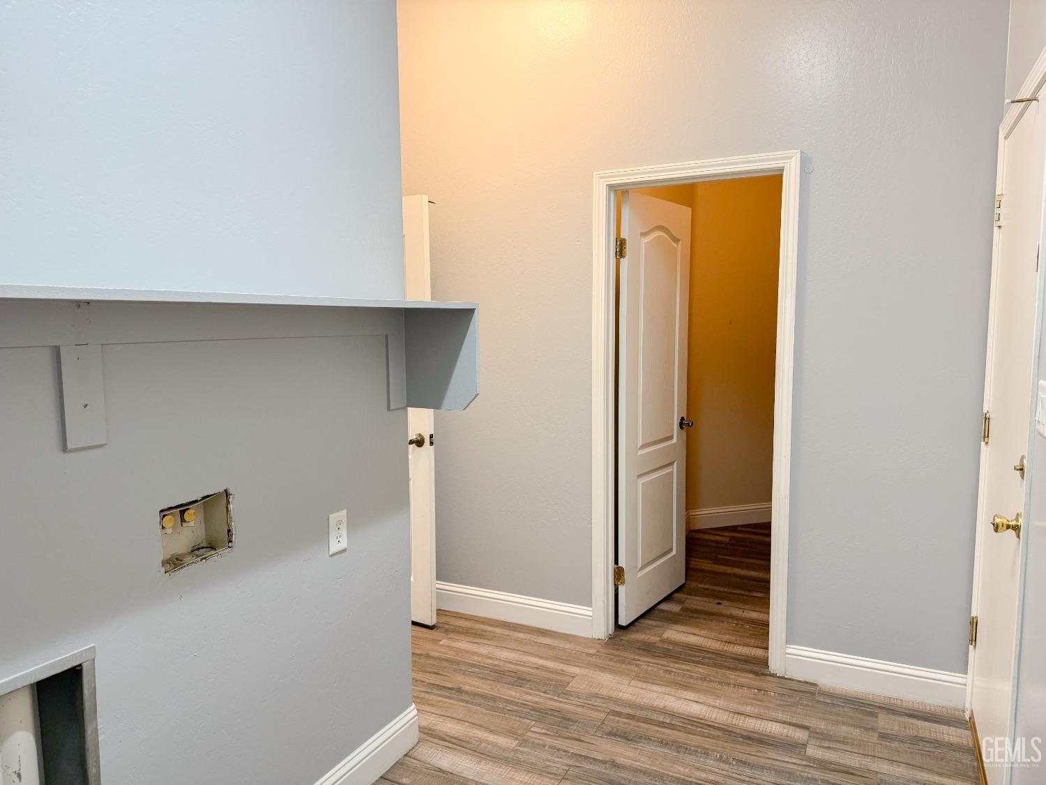 Undisclosed Address Bakersfield, CA 93312 - Photo 18 of 28 a view of a hallway with wooden floor and closet