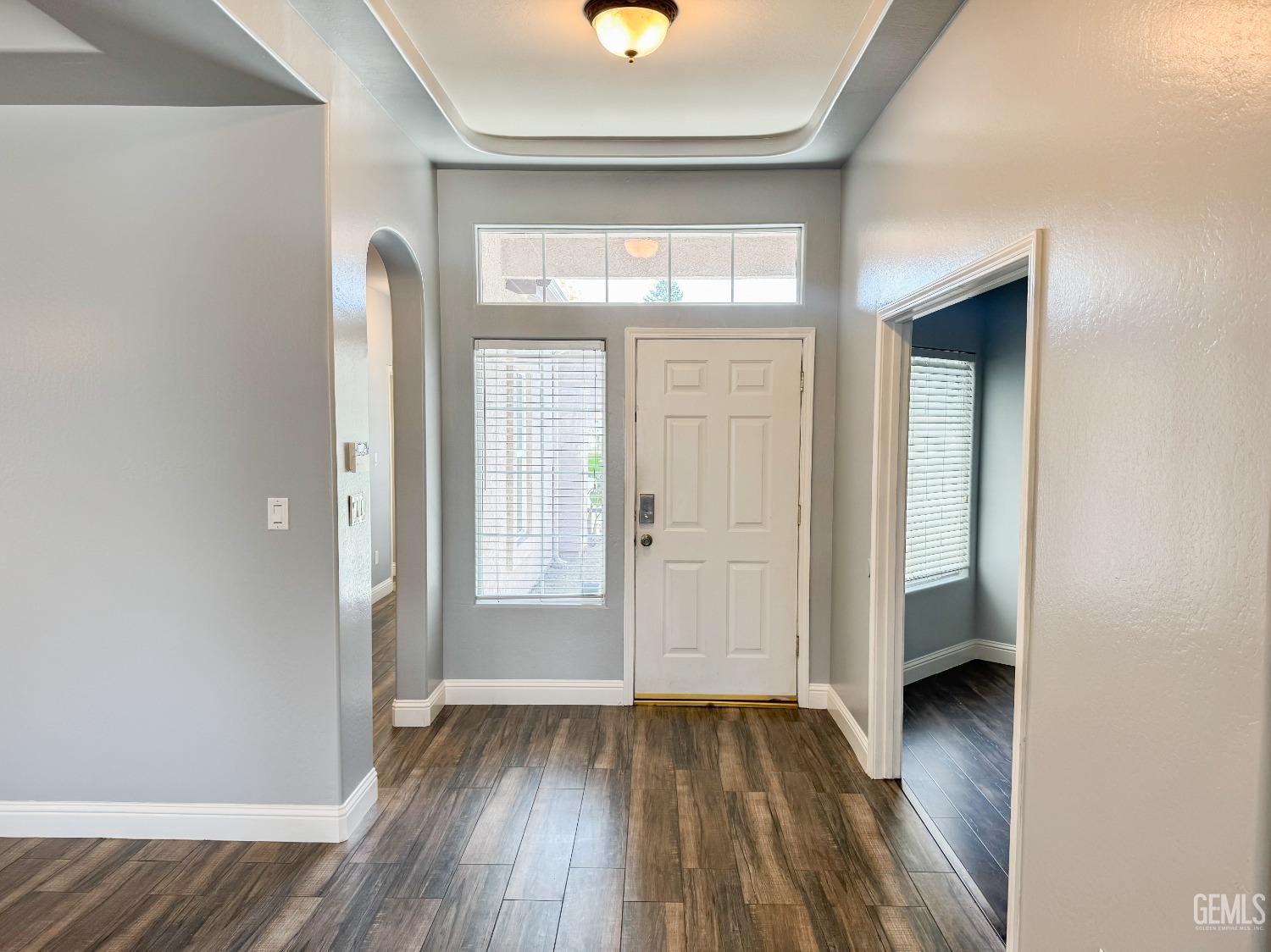 Undisclosed Address Bakersfield, CA 93312 - Photo 2 of 28 wooden floor in an empty room with a window