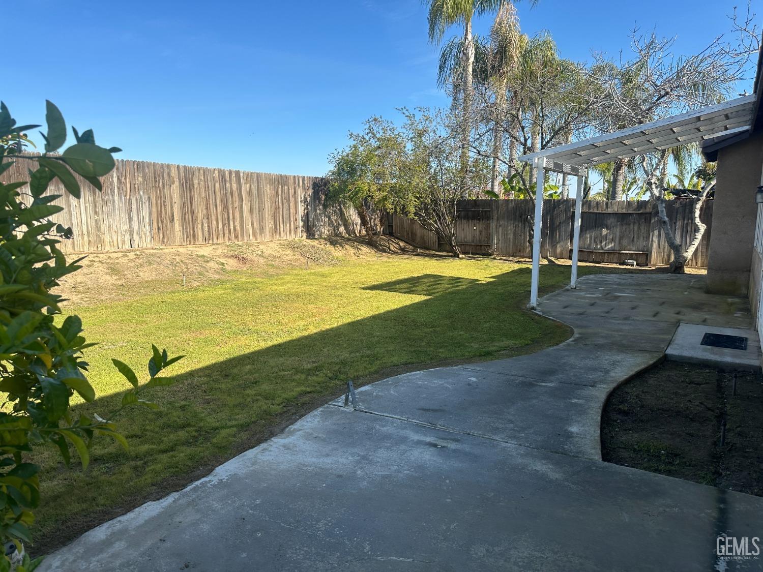 Undisclosed Address Bakersfield, CA 93312 - Photo 28 of 28 a swimming pool with outdoor seating and yard