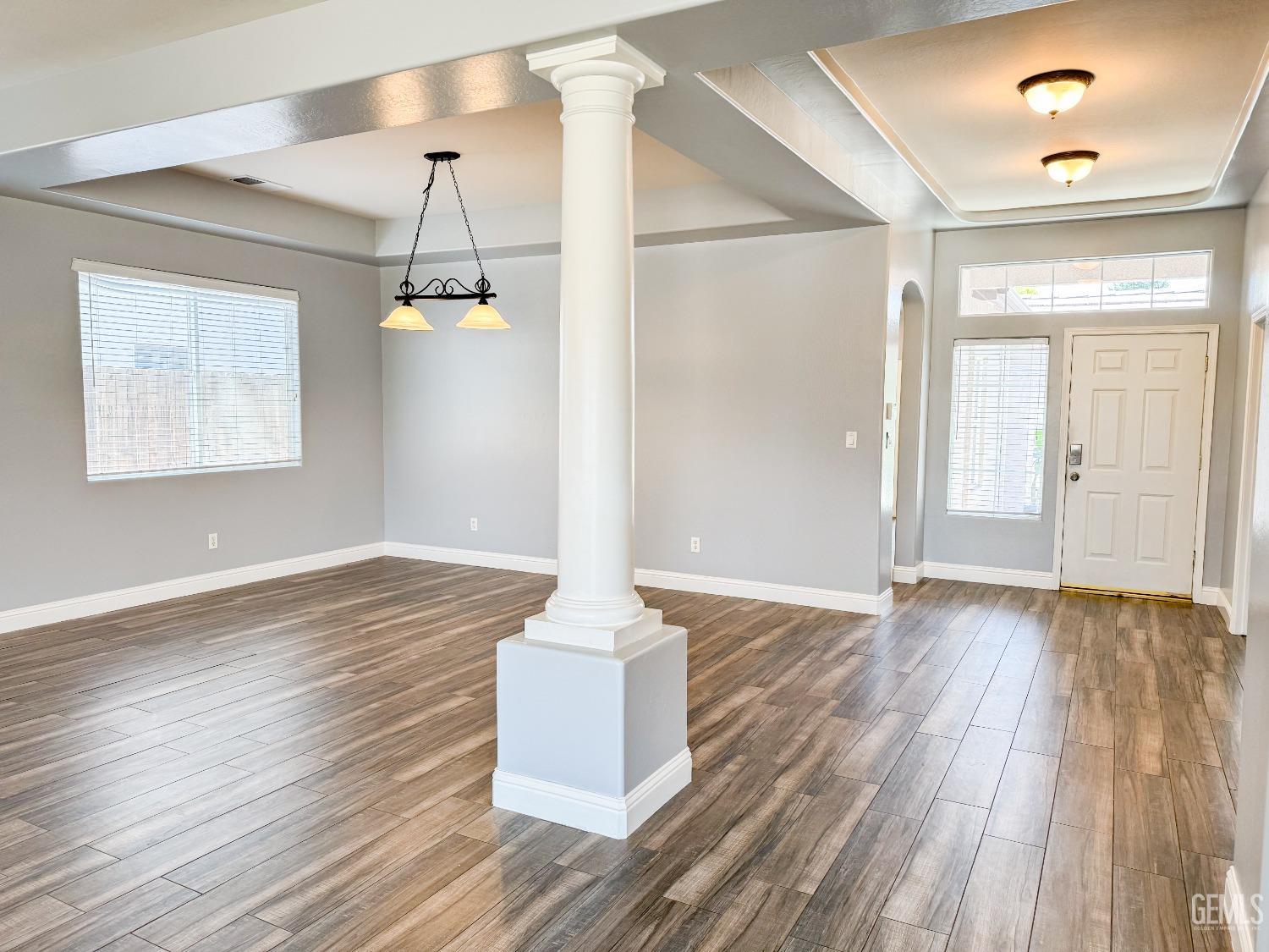 Undisclosed Address Bakersfield, CA 93312 - Photo 3 of 28 a view of a room with wooden floor and staircase