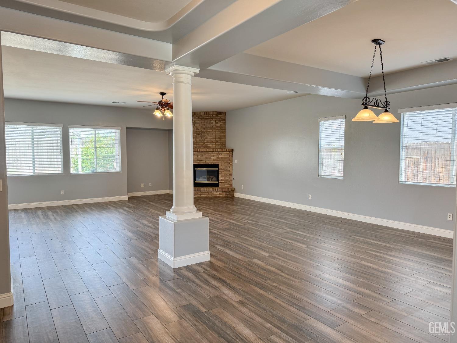 Undisclosed Address Bakersfield, CA 93312 - Photo 7 of 28 a view of empty room with wooden floor and window