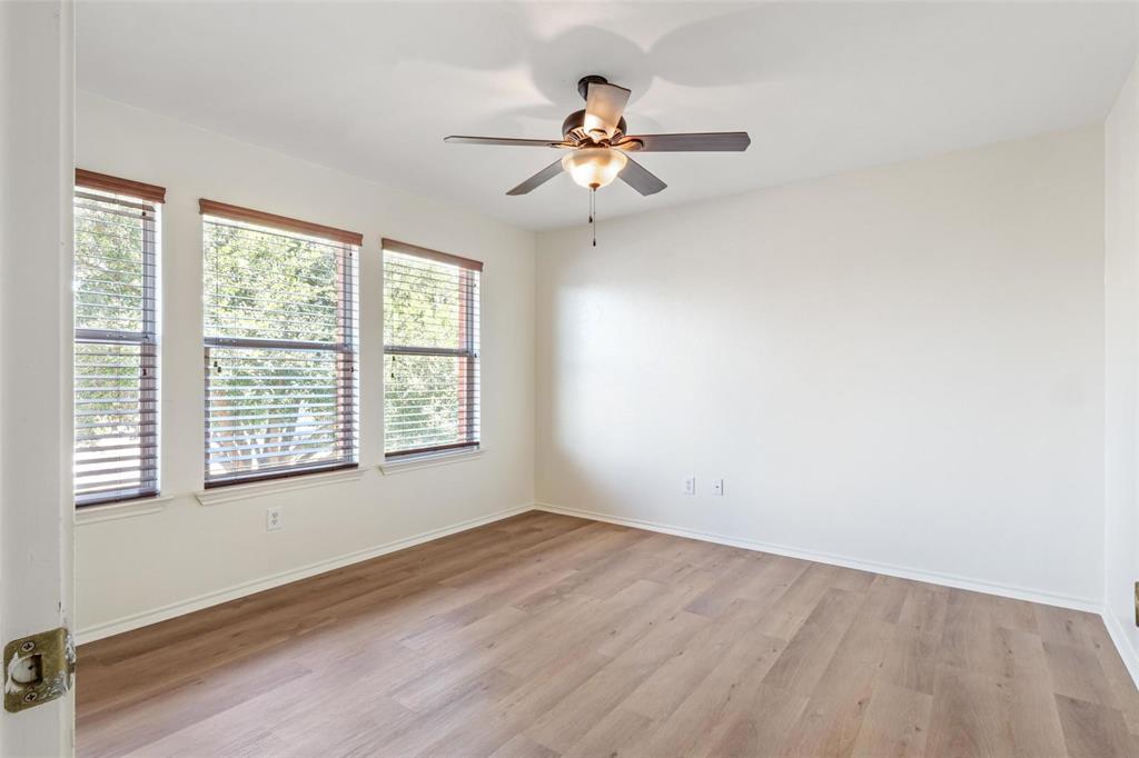 1539 Apollo Circle Round Rock, TX 78664 - Photo 15 of 26 a view of an empty room with wooden floor and a window