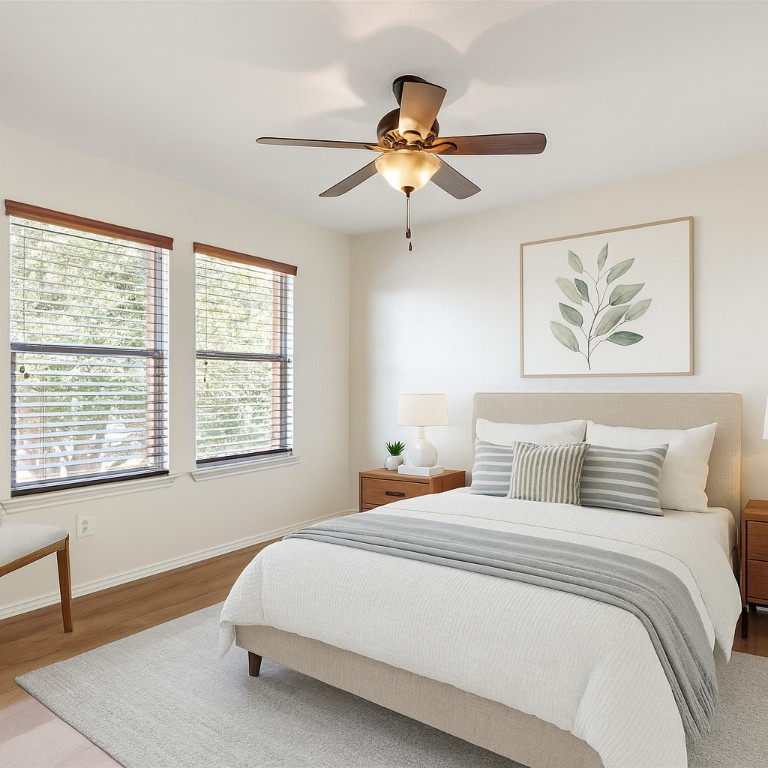 1539 Apollo Circle Round Rock, TX 78664 - Photo 16 of 26 a bedroom with a large bed and a chandelier