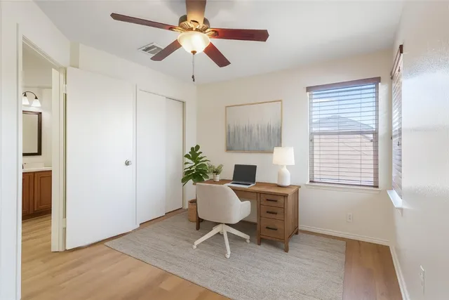 a workspace with furniture and a window