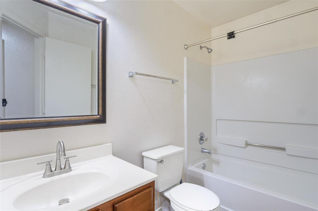 1539 Apollo Circle Round Rock, TX 78664 - Photo 19 of 26 a bathroom with a sink toilet and shower