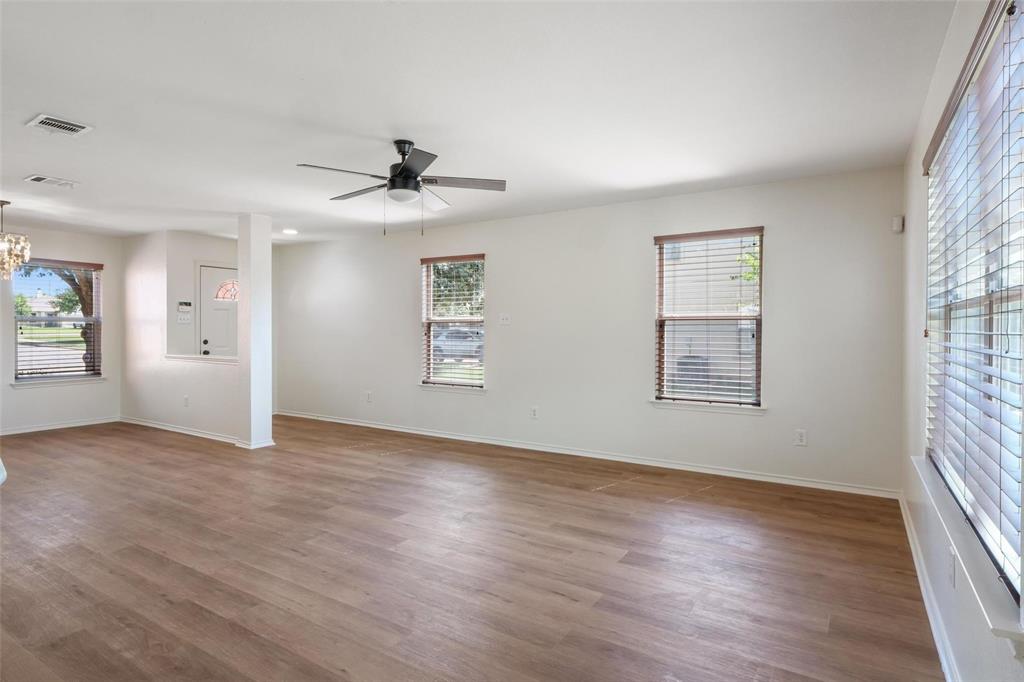 1539 Apollo Circle Round Rock, TX 78664 - Photo 4 of 26 wooden floor in an empty room with a window