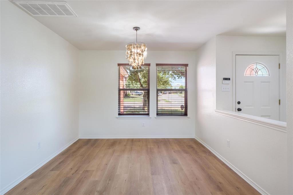 1539 Apollo Circle Round Rock, TX 78664 - Photo 6 of 26 wooden floor in an empty room with a window