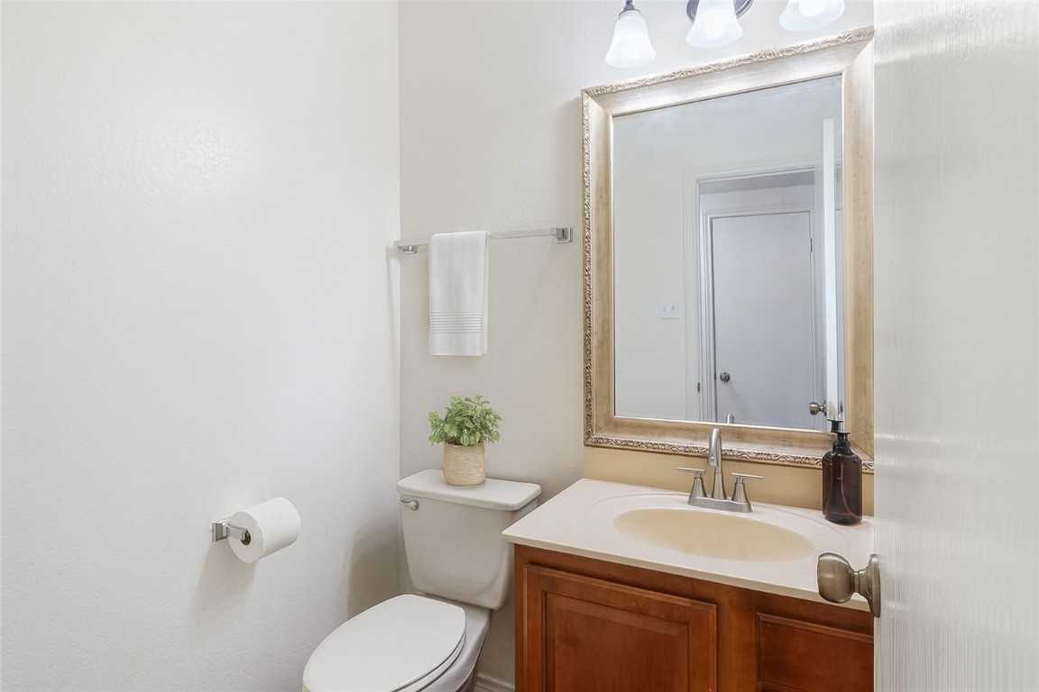 1539 Apollo Circle Round Rock, TX 78664 - Photo 9 of 26 a bathroom with a sink toilet and mirror