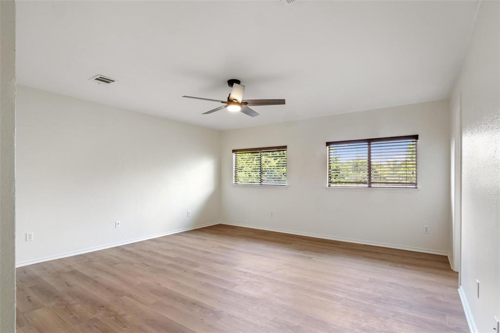 1539 Apollo Circle Round Rock, TX 78664 - Photo 10 of 26 an empty room with fan and windows