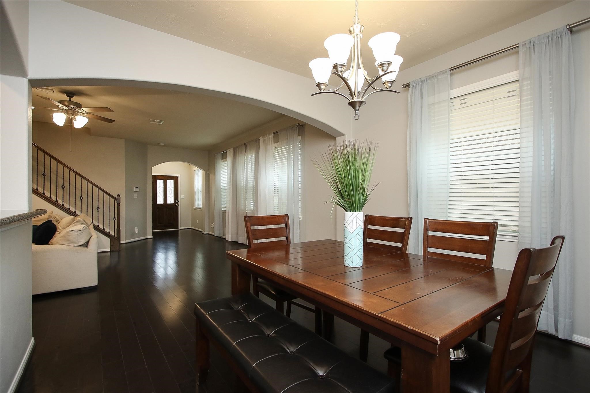 8517 Sunset Loch Drive Spring, TX 77379 - Photo 8 of 22 a view of a dining room with furniture and wooden floor