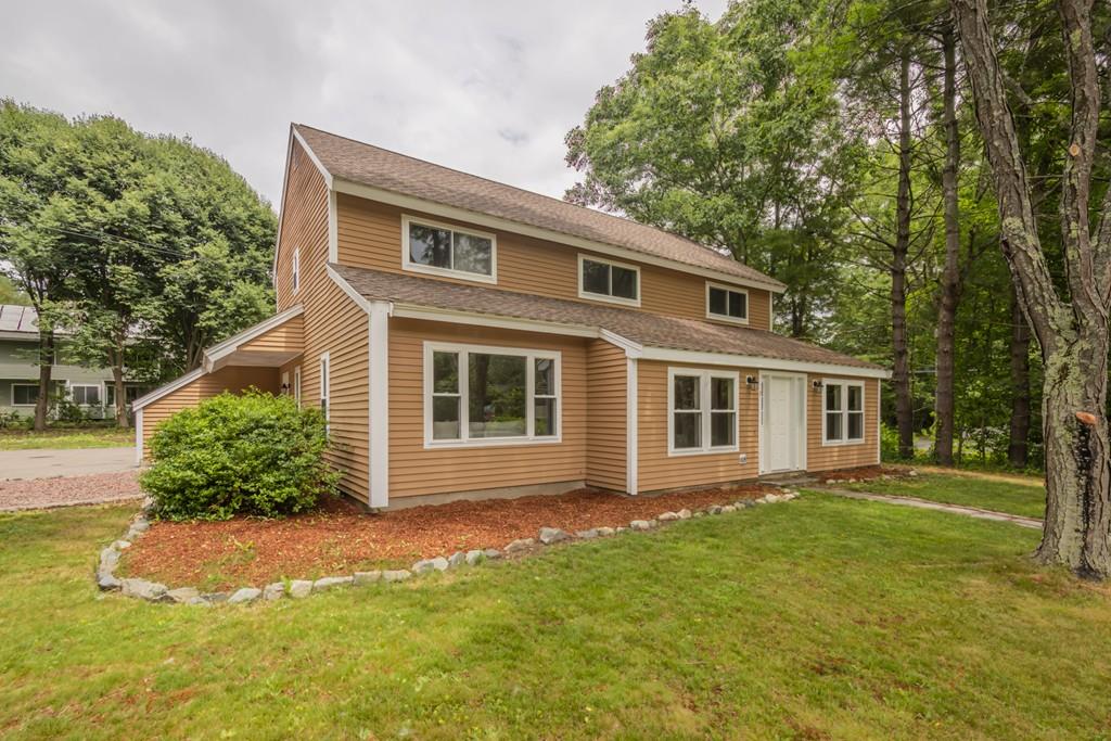 1 Kingman Road Acton, MA 01720 - Photo 1 of 42 a front view of house with yard and trees