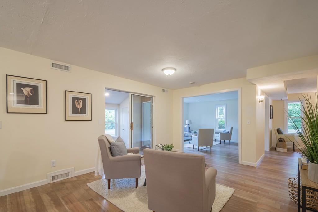 1 Kingman Road Acton, MA 01720 - Photo 20 of 42 a living room with furniture and a wooden floor