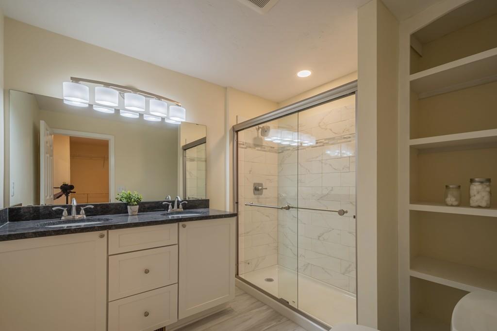 1 Kingman Road Acton, MA 01720 - Photo 34 of 42 a bathroom with a double vanity sink and mirror
