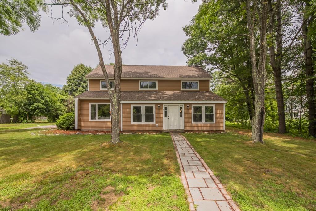 1 Kingman Road Acton, MA 01720 - Photo 42 of 42 a front view of a house with a garden
