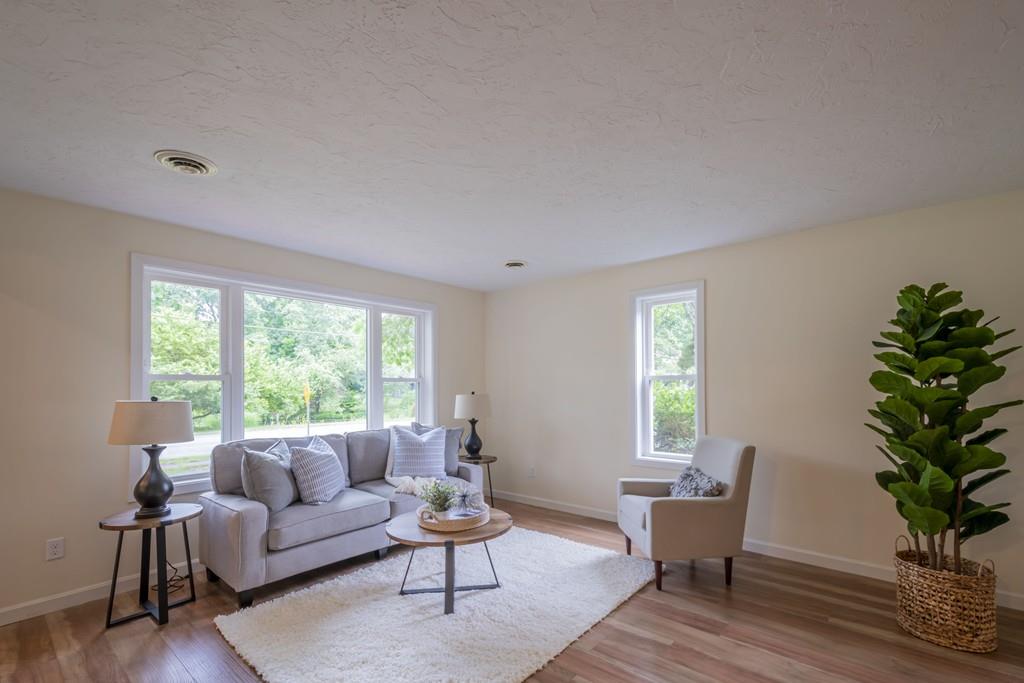 1 Kingman Road Acton, MA 01720 - Photo 5 of 42 a living room with furniture and a potted plant