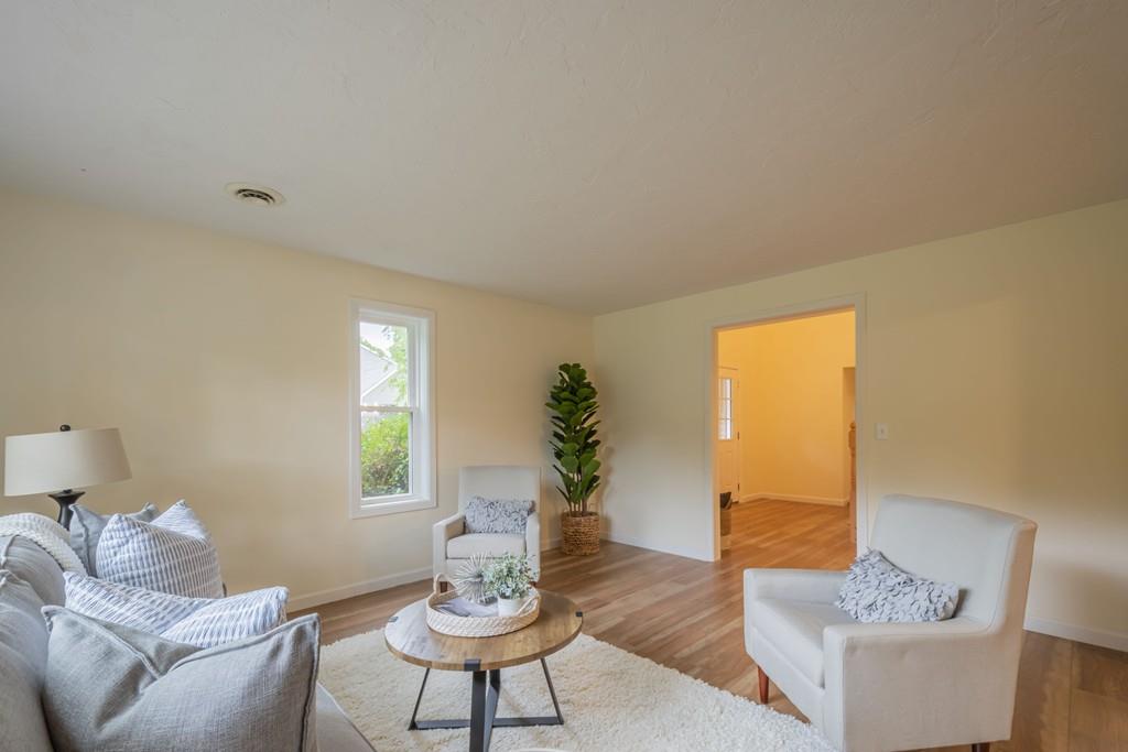1 Kingman Road Acton, MA 01720 - Photo 9 of 42 a living room with furniture and a potted plant
