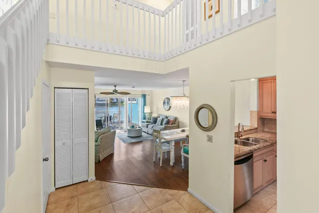 a living room with furniture chandelier and a chandelier
