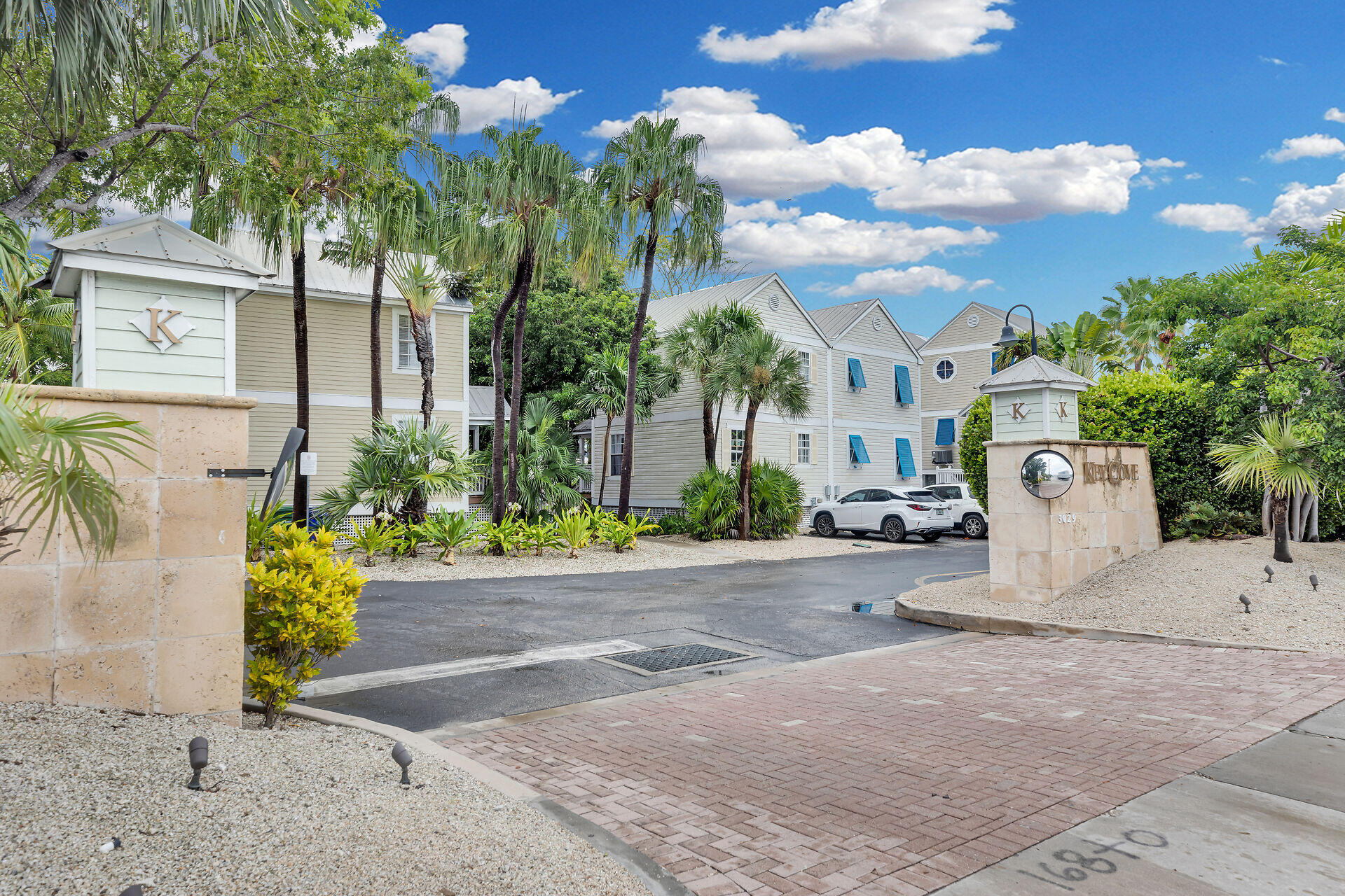 3029 North Roosevelt Boulevard, Unit 54 Key West, FL 33040 - Photo 1 of 31 front view of a house with a yard and potted plants