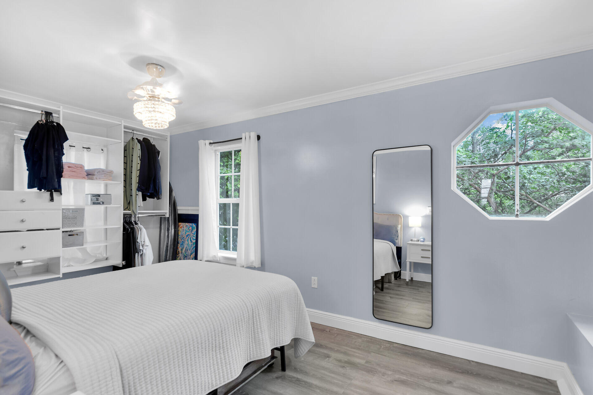 3029 North Roosevelt Boulevard, Unit 54 Key West, FL 33040 - Photo 11 of 31 a spacious bedroom with a bed and a chandelier