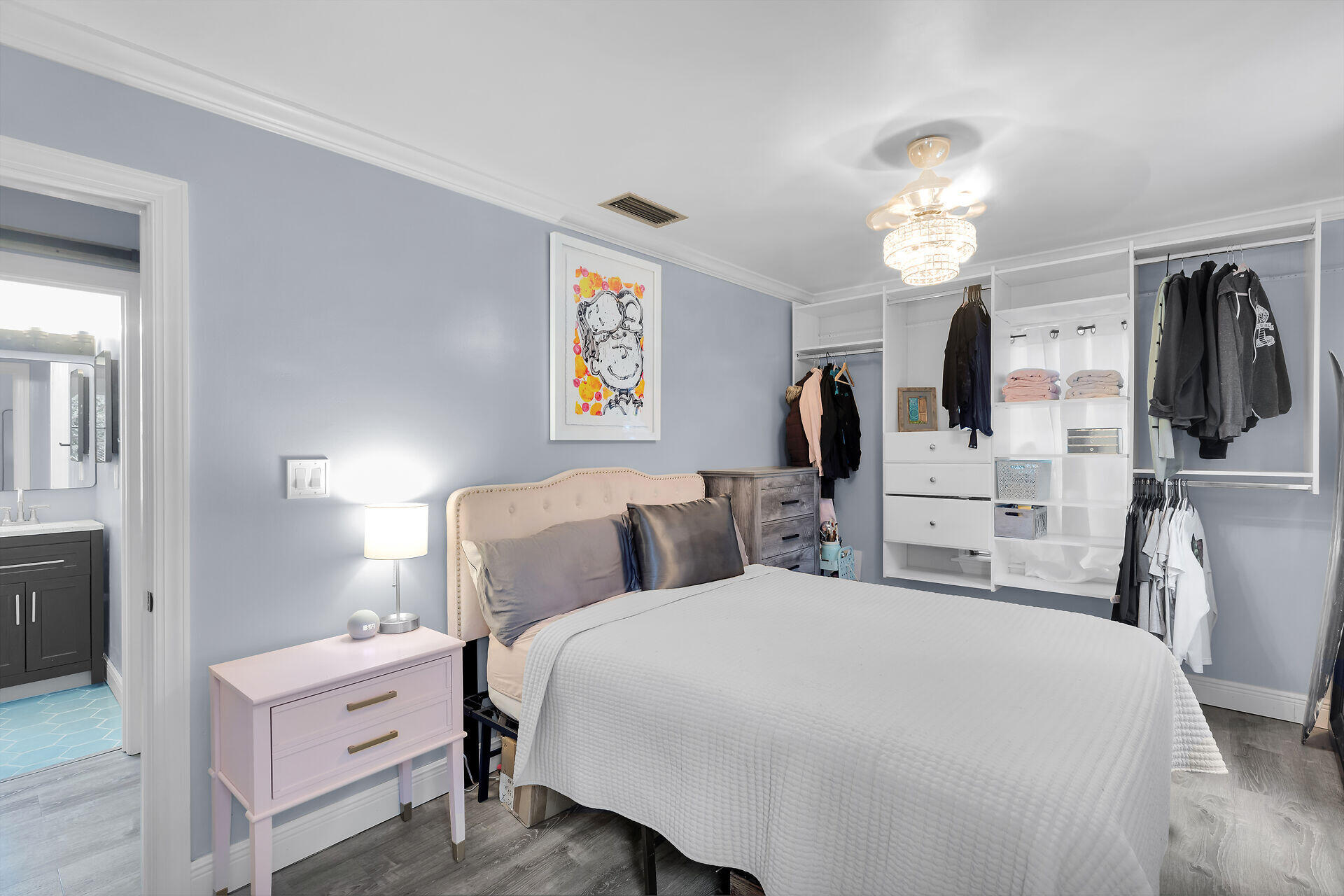 3029 North Roosevelt Boulevard, Unit 54 Key West, FL 33040 - Photo 12 of 31 a bedroom with a bed and a chandelier