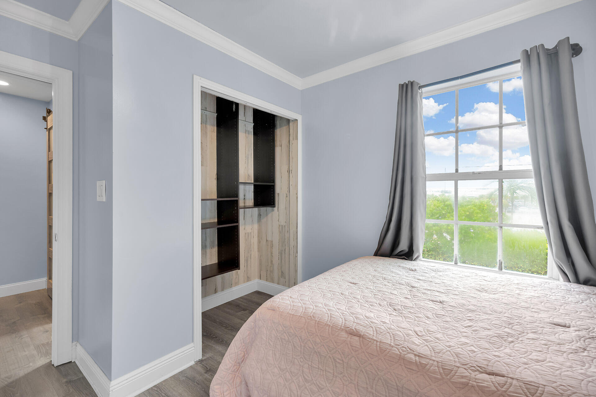 3029 North Roosevelt Boulevard, Unit 54 Key West, FL 33040 - Photo 17 of 31 a bedroom with a bed and a large window