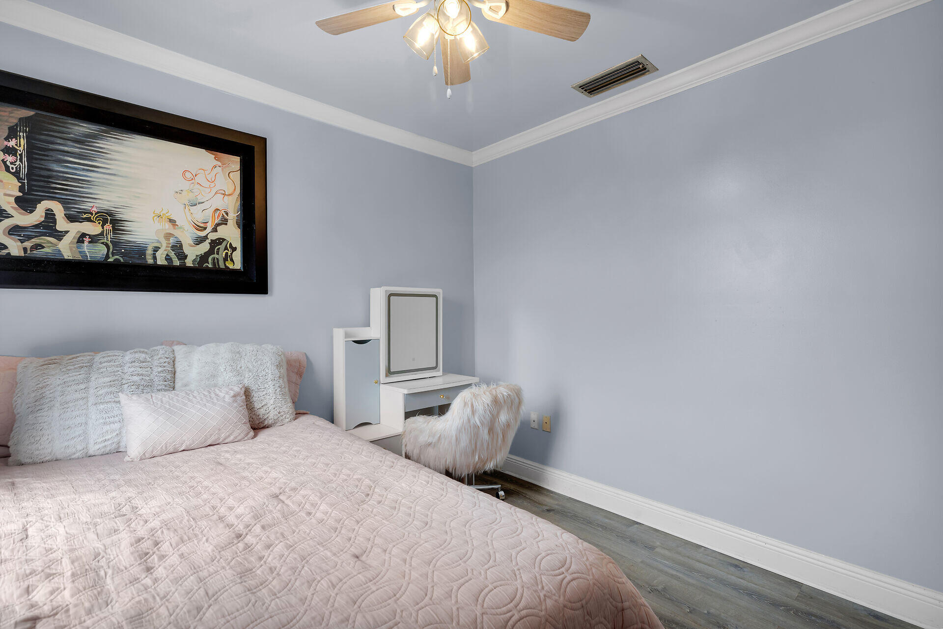 3029 North Roosevelt Boulevard, Unit 54 Key West, FL 33040 - Photo 18 of 31 a bedroom with a bed and a painting on the wall