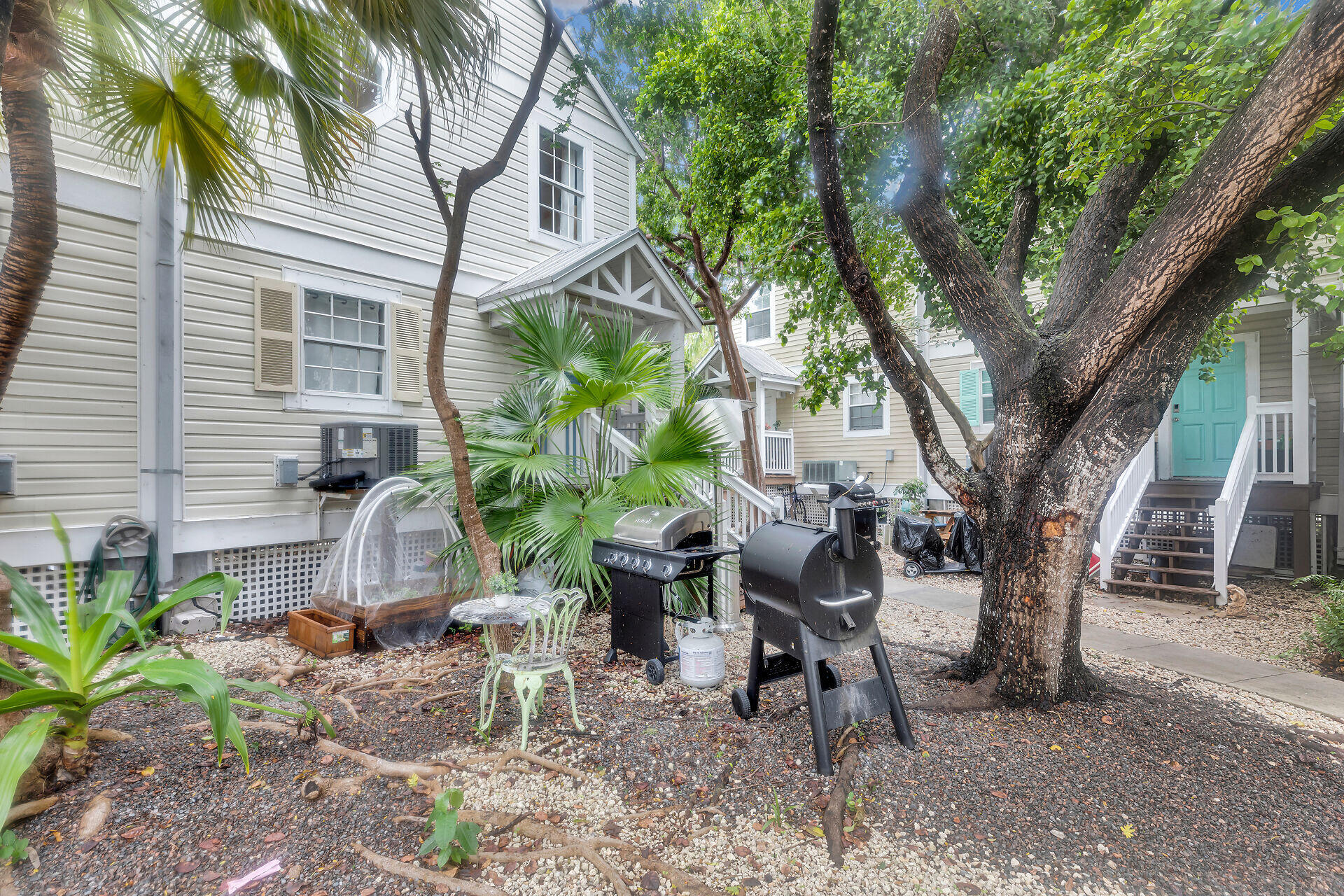 3029 North Roosevelt Boulevard, Unit 54 Key West, FL 33040 - Photo 19 of 31 a backyard of a house with seating space