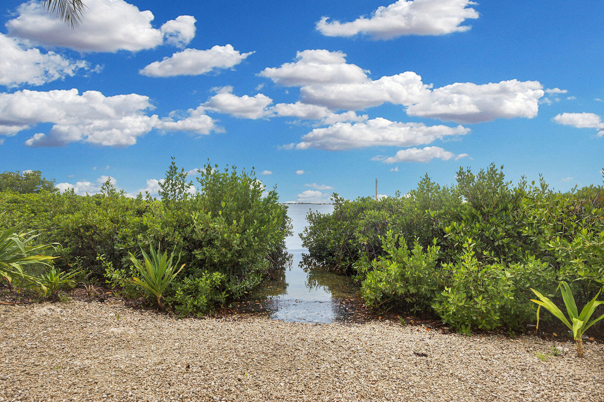3029 North Roosevelt Boulevard, Unit 54 Key West, FL 33040 - Photo 25 of 31 a view of a pathway with a yard