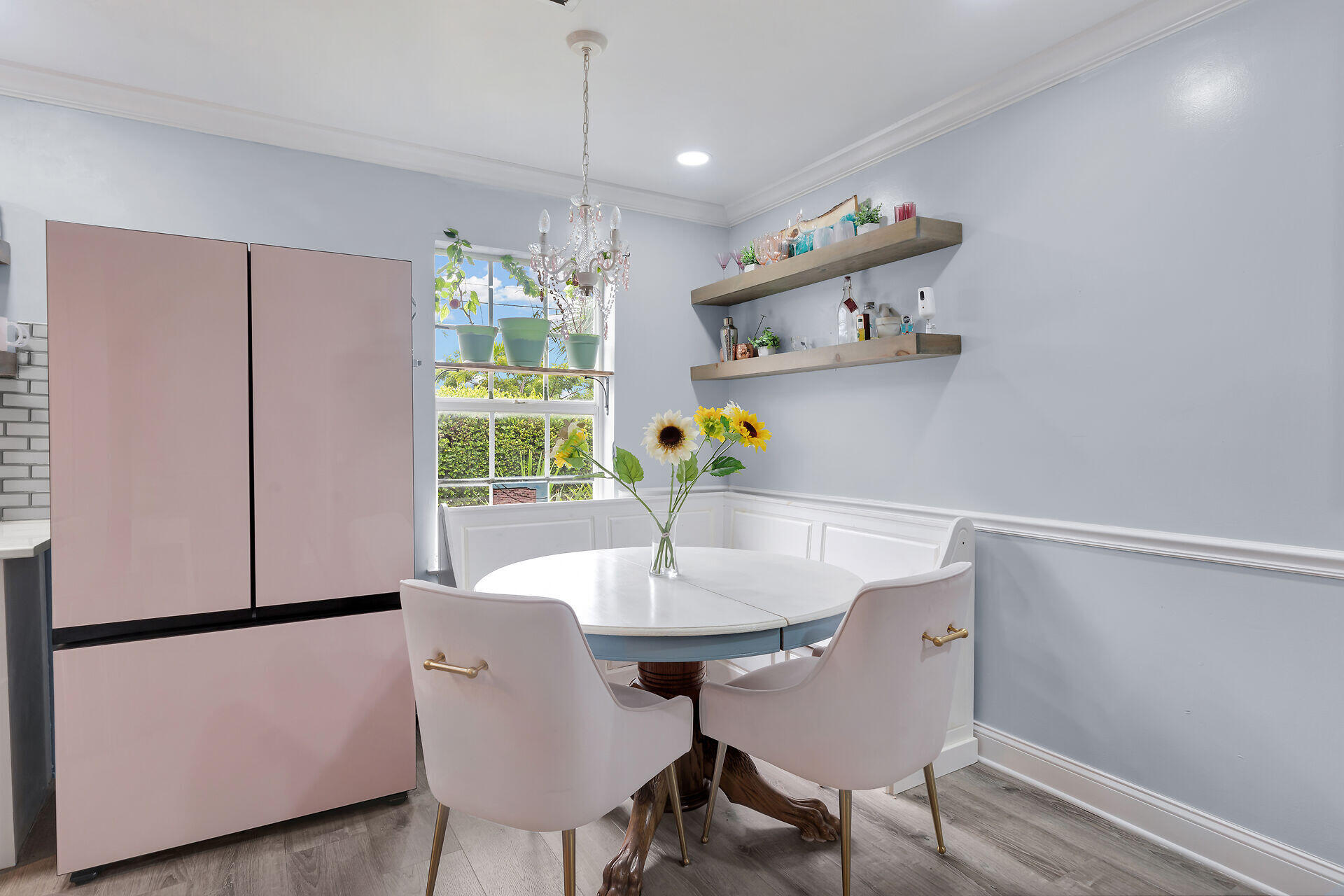 3029 North Roosevelt Boulevard, Unit 54 Key West, FL 33040 - Photo 8 of 31 a view of a dining room with furniture window and wooden floor