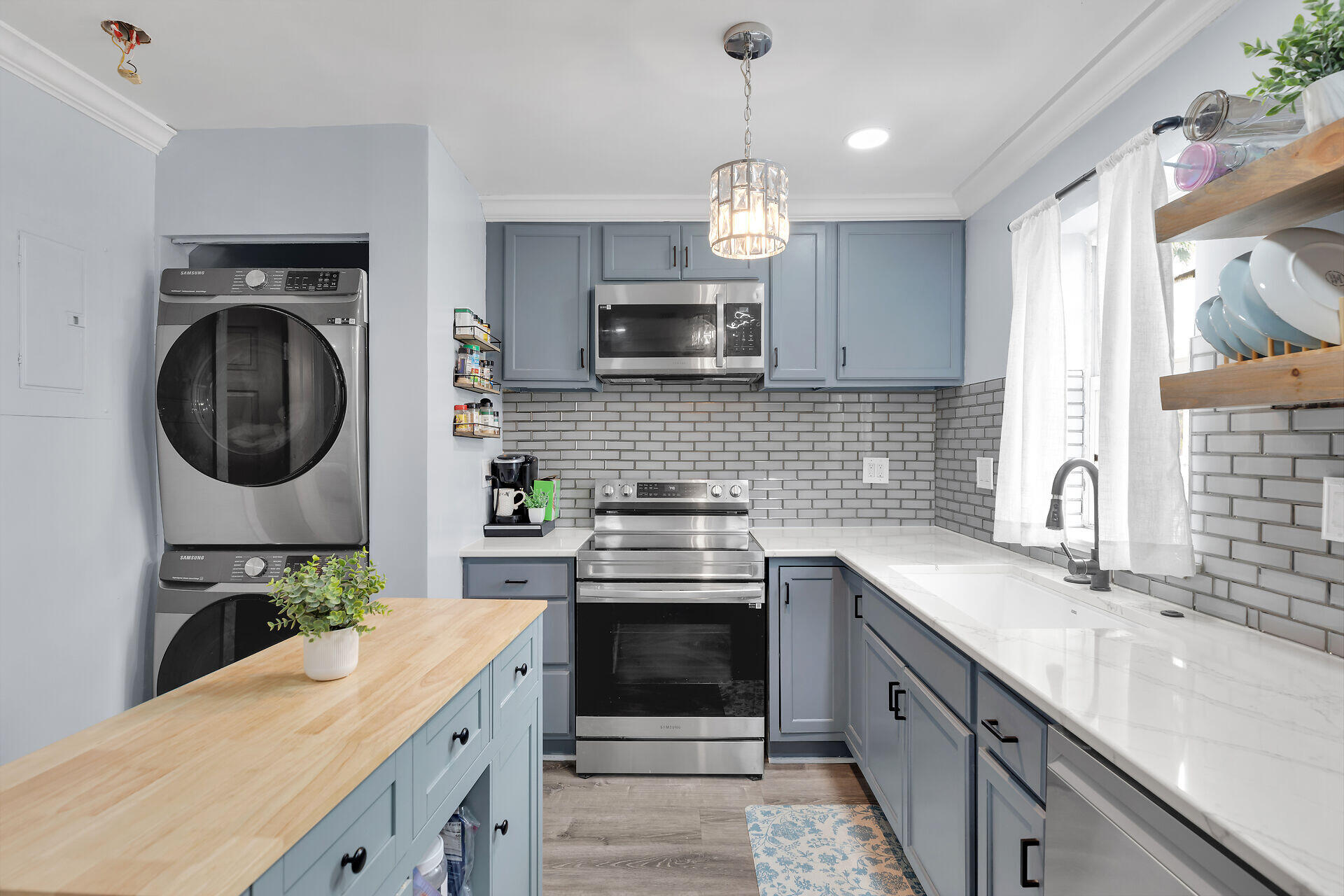 3029 North Roosevelt Boulevard, Unit 54 Key West, FL 33040 - Photo 10 of 31 a kitchen with a stove and a sink
