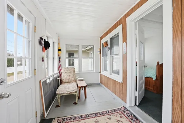 a bedroom with furniture and a window