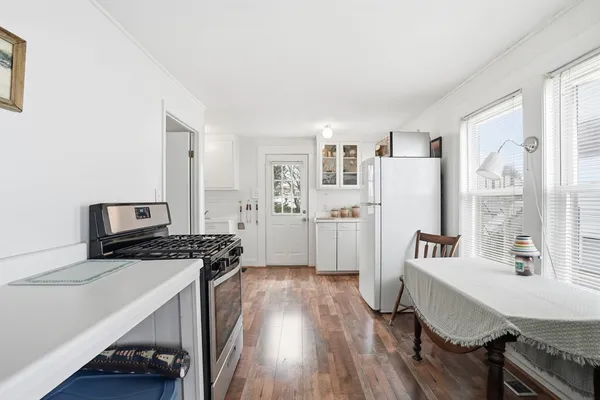 a view of cabinets and wooden floor