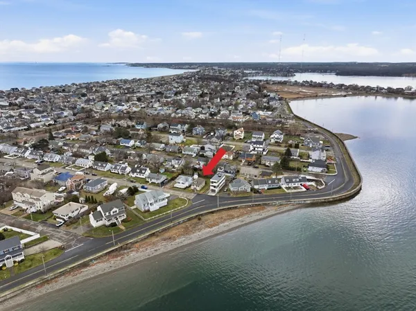 an aerial view of a house with a lake view