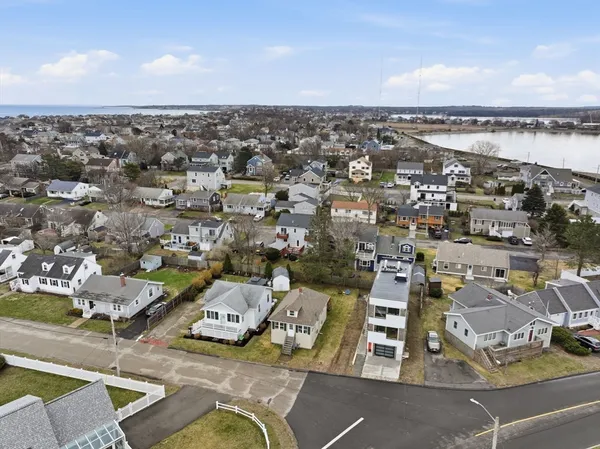 an aerial view of a house with lake view
